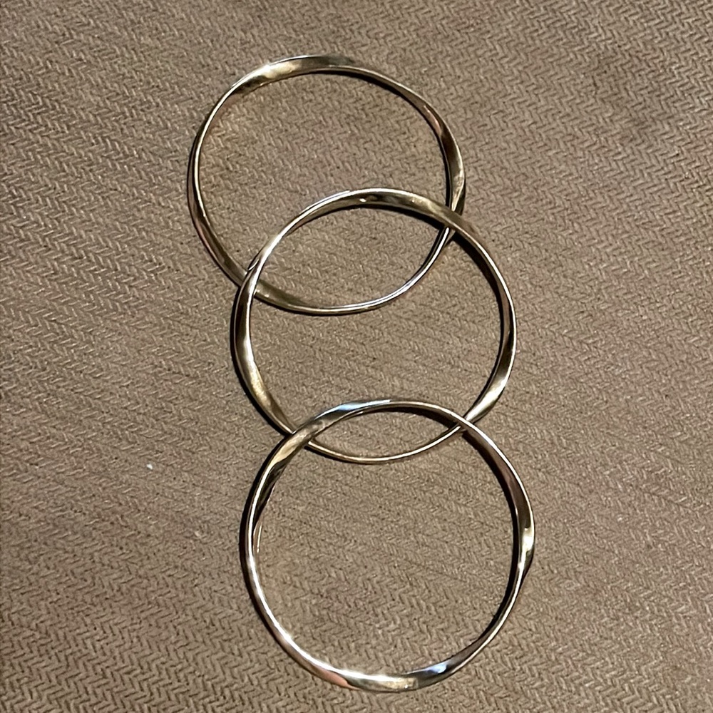 3 stackable golden bracelets